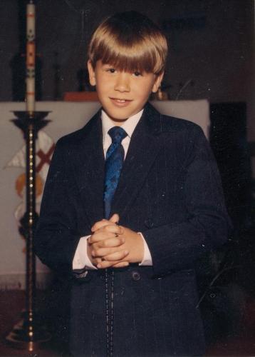 Riley in his first holy communion photo.